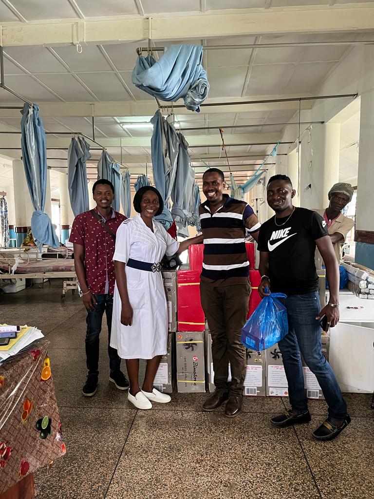 Senior Matron Fatmata Kanja-Jalloh receives donation. TOSHPA  replaces bedside fans and ceiling fans in ward 6 Connaught hospital, Freetown  Sierra Leone.